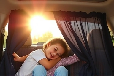 Family resting comfortably in a car with sunshade curtains.